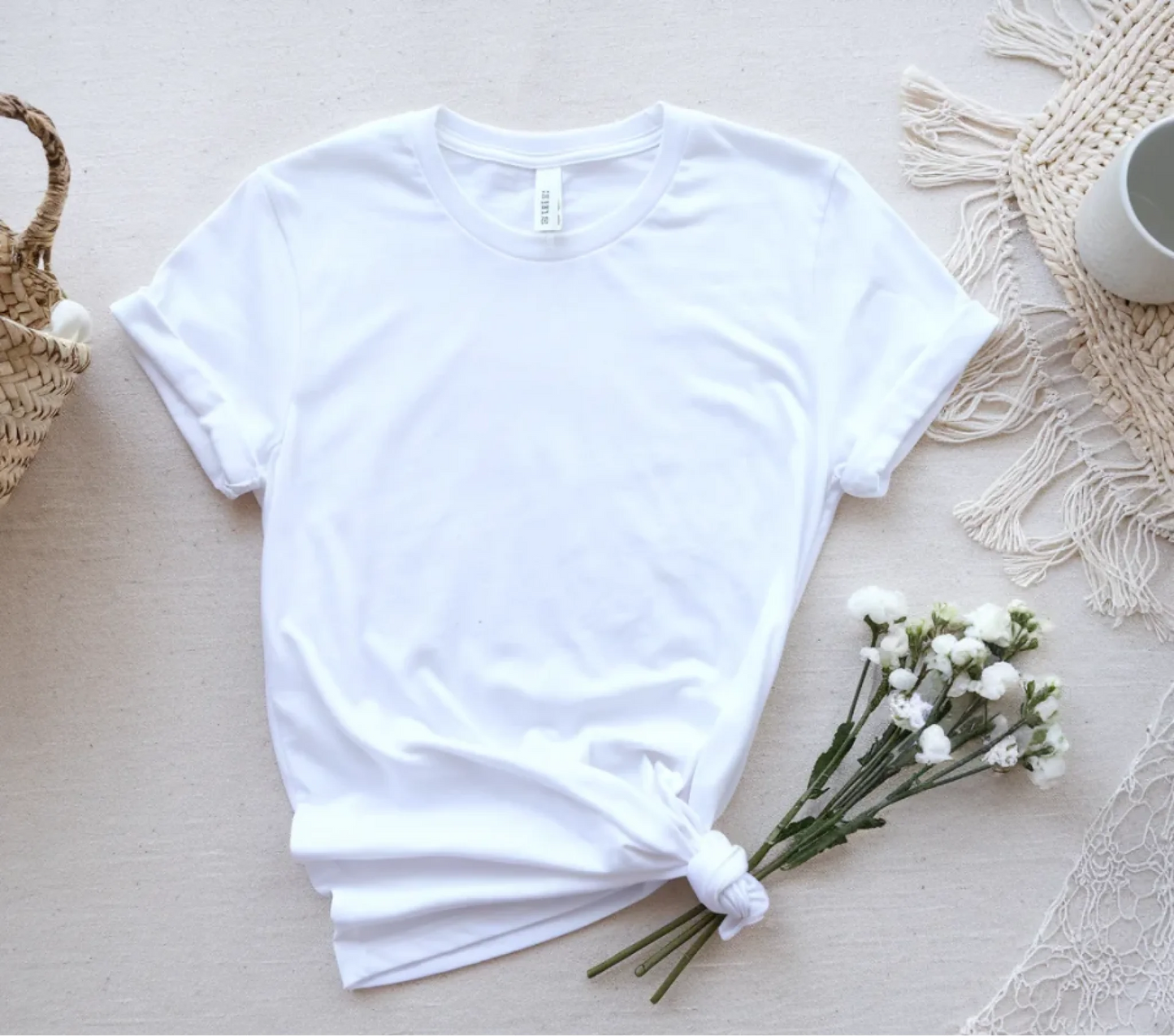 a-flat-lay-of-a-white-t-shirt-placed-on-_F4MmJmAaSd-vgwcSwhmHgg_EeNDaviUQ7ap9eVrPTqsKg